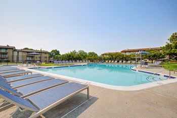 Sparkling swimming pool with sundeck